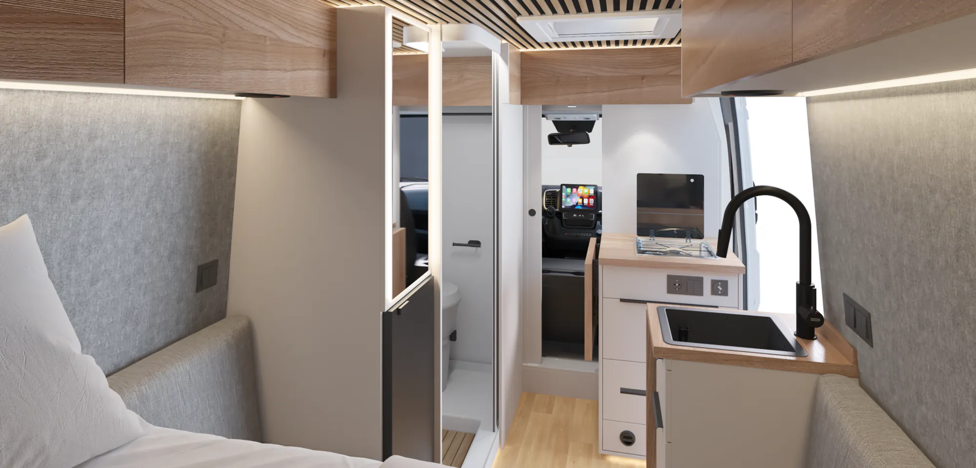 Interior de la Neo S con mobiliario blanco y encimeras efecto madera